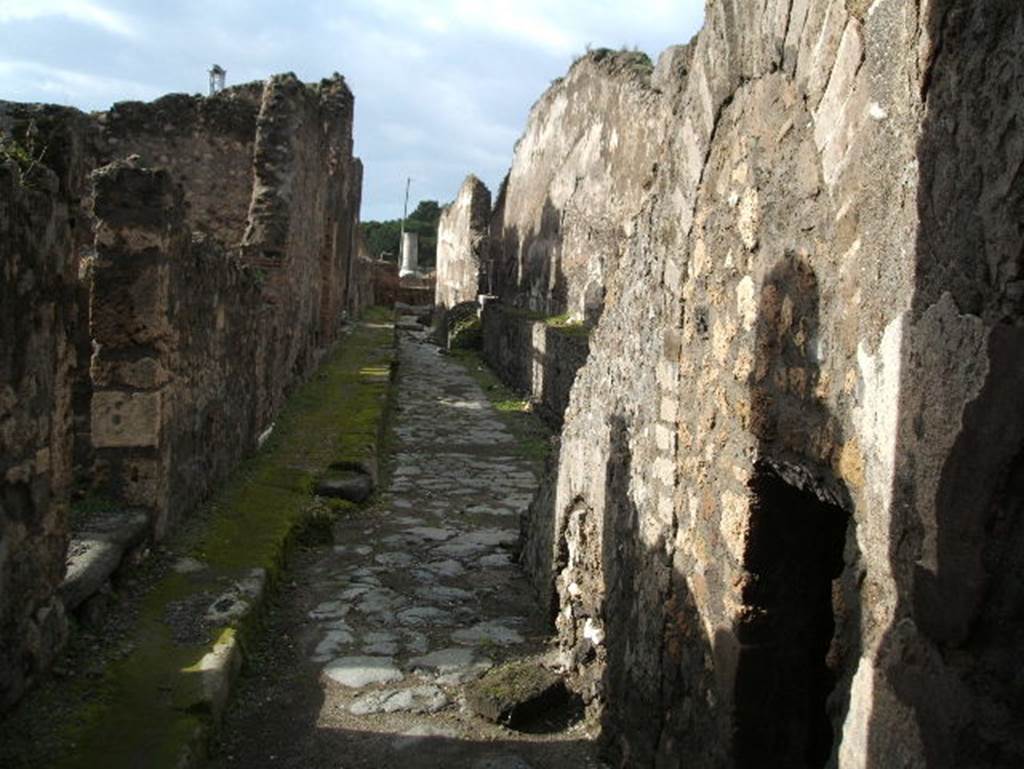 VIII.2 Pompeii. December 2005. Looking west along Via Championnet, with VIII.1.6 and ramp, in centre, with VIII.1.7 Steps, on right.