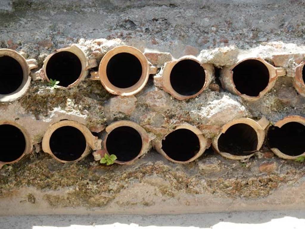 VIII.2.13/14/16 Pompeii. May 2018. Detail of terracotta pots/pipes at west end. Photo courtesy of Buzz Ferebee.