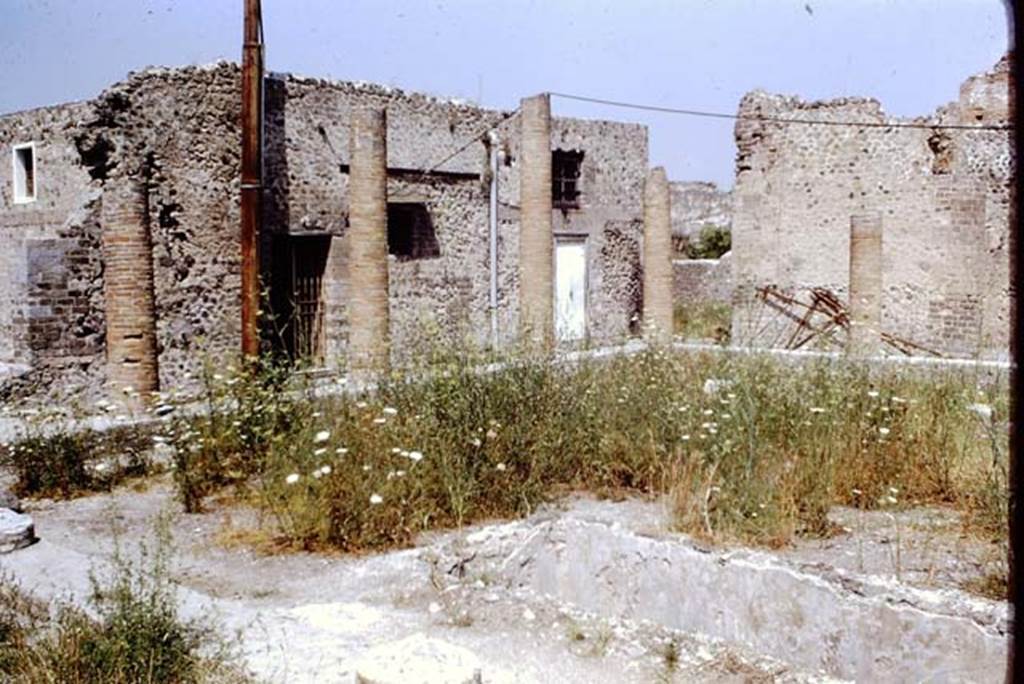 VIII.2.13/14/16 Pompeii, 1968. 
Looking north-west across peristyle towards open doorway leading from VIII.2.5, (centre right). Photo by Stanley A. Jashemski.
Source: The Wilhelmina and Stanley A. Jashemski archive in the University of Maryland Library, Special Collections (See collection page) and made available under the Creative Commons Attribution-Non-Commercial License v.4. See Licence and use details.
J68f1231

