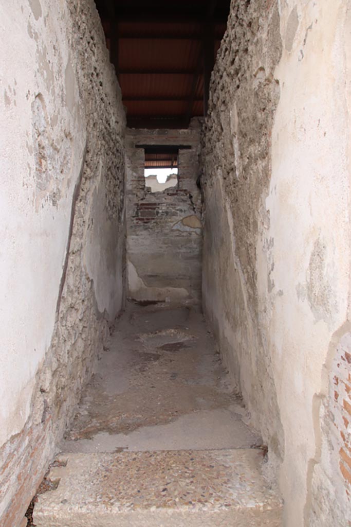 VIII.2.22 Pompeii. May 2024. 
Looking south, with line of steps to upper floor visible on both side walls. Photo courtesy of Klaus Heese.
