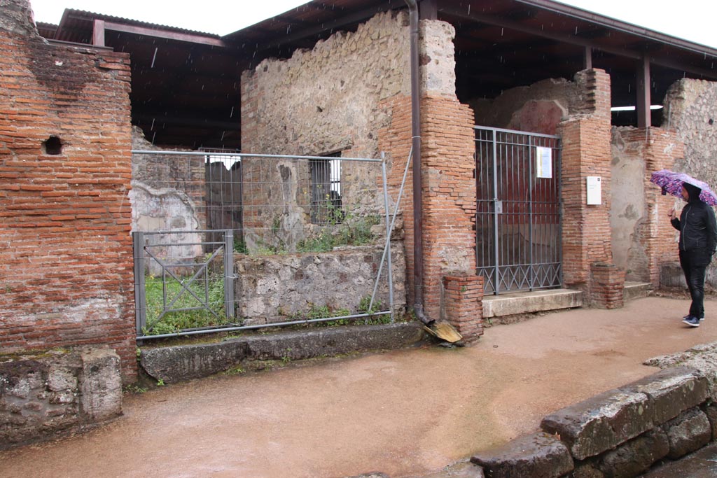 VIII.2.24 Pompeii, on left, and VIII.2.23, on right. May 2024. 
Looking towards entrances on south side of Vicolo della Regina. Photo courtesy of Klaus Heese. 
