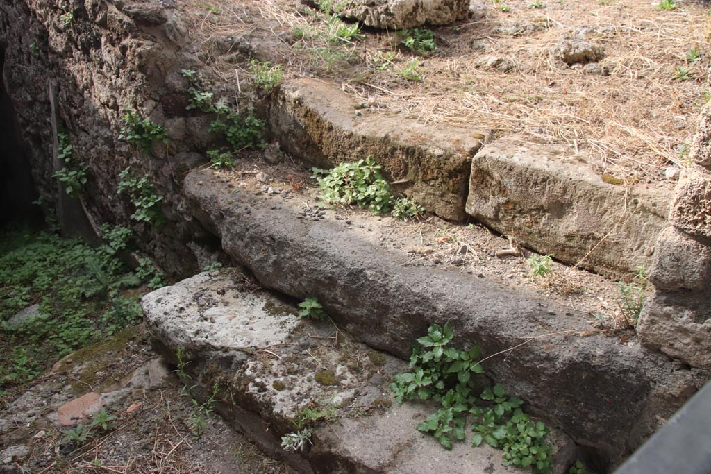 VIII.2.27 Pompeii. October 2023. Steps into kitchen area of VIII.2.26 from corridor to lower floor. Photo courtesy of Klaus Heese.