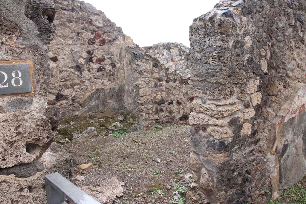 VIII.2.28 Pompeii. October 2020. Looking through doorway on left (east) side of entrance corridor, leading to the anteroom of the kitchen.
Photo courtesy of Klaus Heese.
