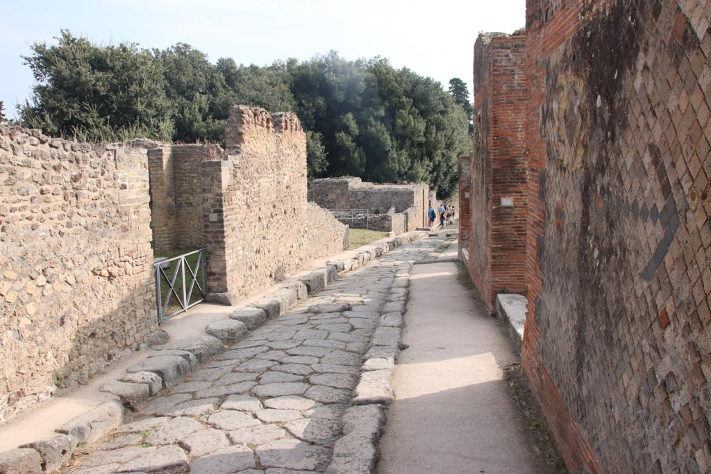 VIII.2.30, Pompeii, on right. October 2023. Looking east along Via della Regina from entrance doorway. Photo courtesy of Klaus Heese.