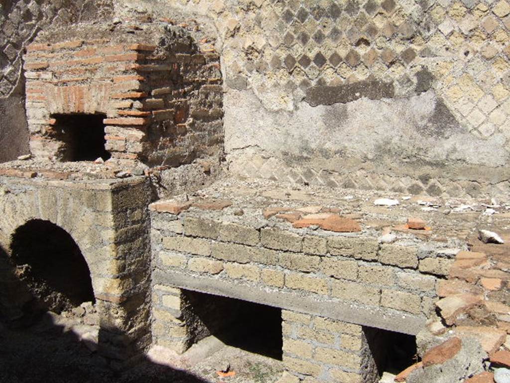 VIII.2.30 Pompeii. September 2005. Large hearth and small oven near north wall of kitchen.