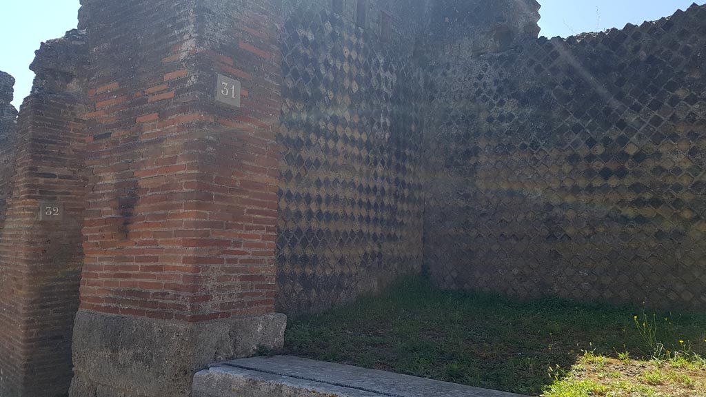 VIII.2.31 Pompeii. August 2023. Looking south-east towards entrance doorway of shop. Photo courtesy of Maribel Velasco.