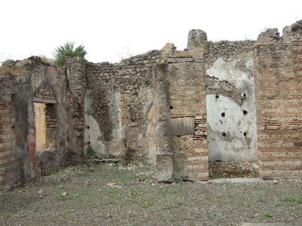 VIII.2.39 Pompeii.  May 2006.   Room h, Ala on west side of atrium, and Doorway to Room k, with shelving supports on west wall.