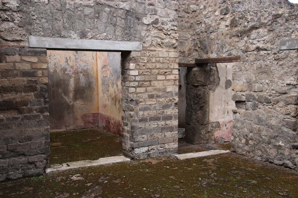 VIII.3.12 Pompeii. October 2020. 
Looking towards west side of yard/courtyard, with doorways to oecus, on left, and corridor across triclinium, on right. 
Photo courtesy of Klaus Heese.

