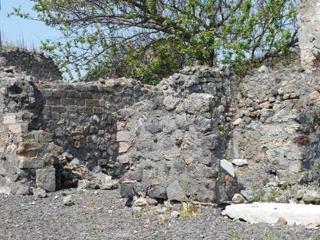 VIII.3.15 Pompeii. May 2010. Doorway to triclinium 4 on west (left) side, and masonry pilaster dividing room 3 from room 2, in centre.