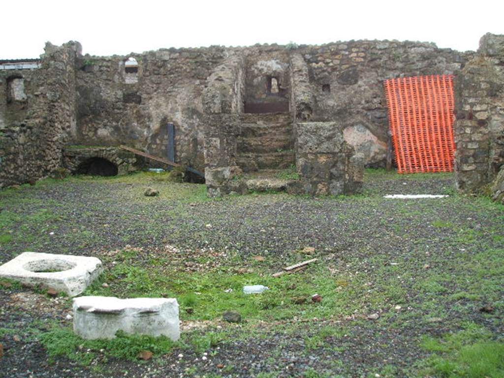 VIII.3.18 Pompeii. December 2004. 
Showing steps to upper floor which are above VIII.3.17, entrance to cellar reached from street level.

