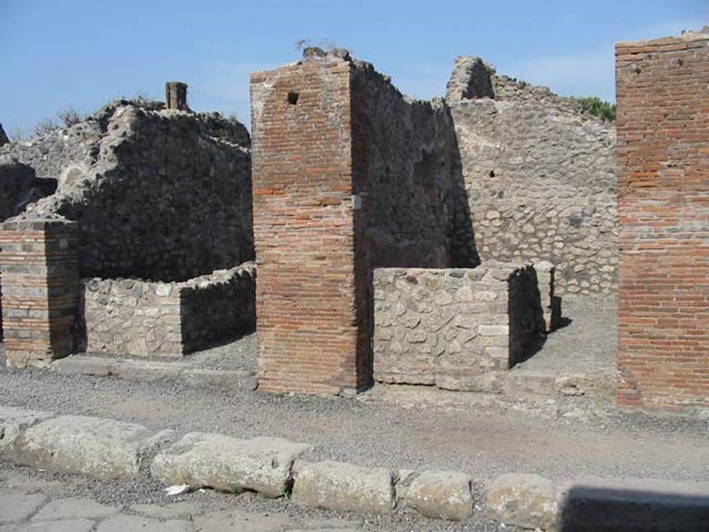 VIII.3.23, on left,  and VIII.3.22, Pompeii. May 2003. Looking east to entrances. Photo courtesy of Nicolas Monteix.