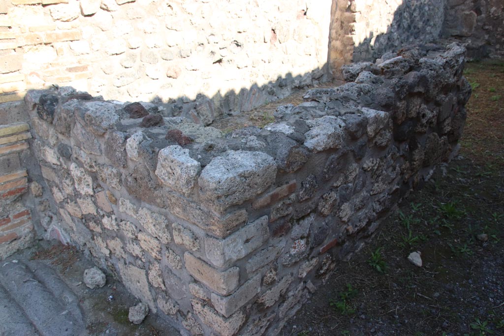 VIII.3.23 Pompeii. October 2022. Looking north-east towards rear of counter and north wall. Photo courtesy of Klaus Heese. 