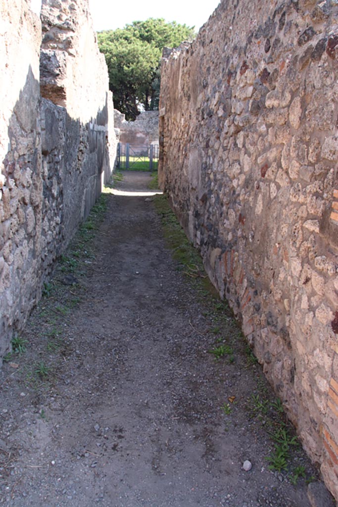 VIII.3.24 Pompeii. October 2022. 
Looking east along entrance corridor/fauces towards doorway to room, on right. 
Photo courtesy of Klaus Heese.


