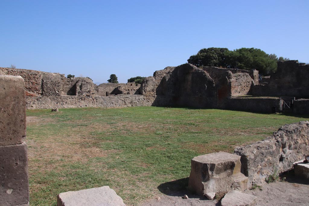 VIII.2.33 Pompeii. October 2023. 
Looking south-east across VIII.3.1, Comitium or Sala delle Elezioni, from doorway on west side. Photo courtesy of Klaus Heese.
