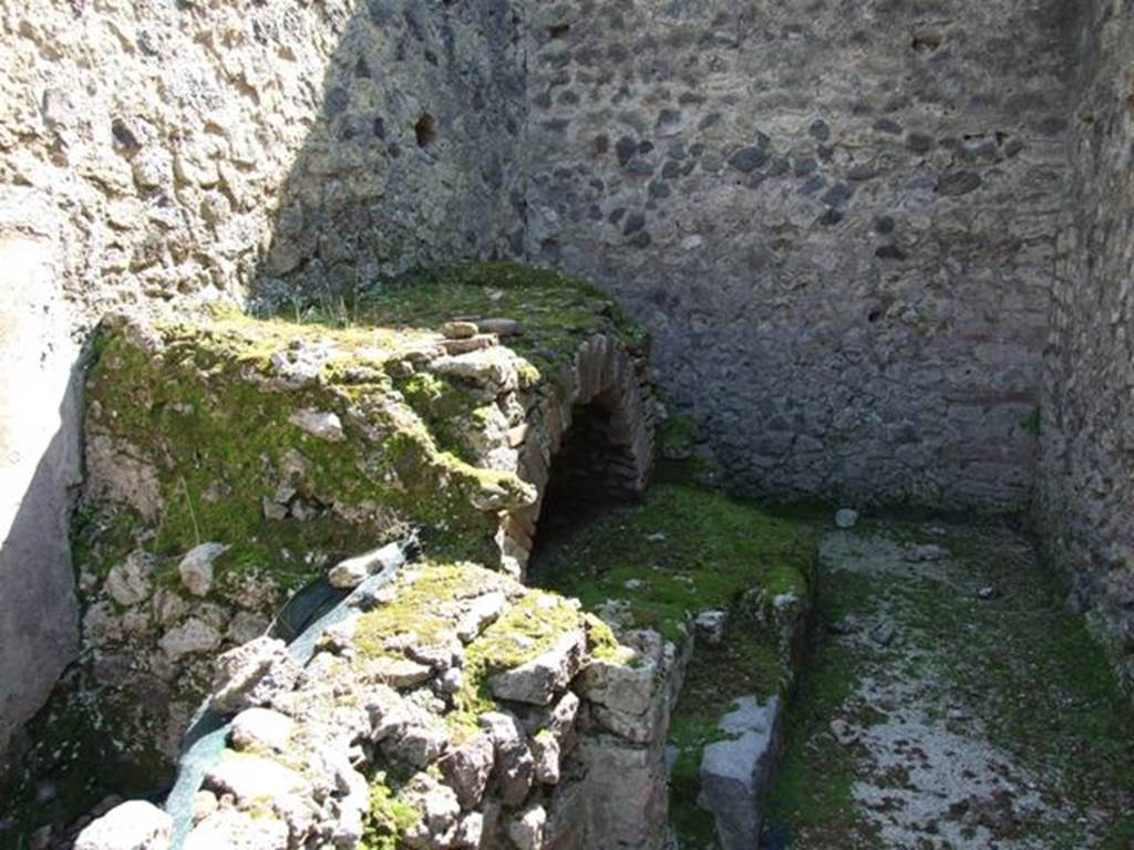 VIII.4.4 Pompeii. March 2009. Room 7, east wall of kitchen. Looking south to remains of hearth.