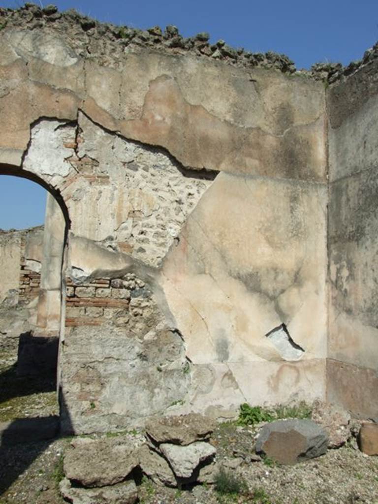 VIII.4.4 Pompeii.  March 2009.  Room 9.  East portico.  Remains of wall plaster in north east corner.