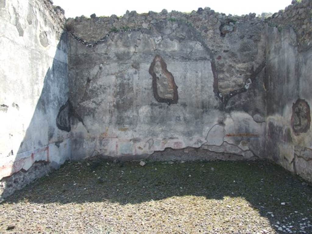 VIII.4.4 Pompeii. March 2009. Room 11, south wall of exedra.  In the centre of the south wall, would have been the painting of Narcissus looking at himself in the water. When found the painting was very damaged due to the hole left by the ancient searchers who had penetrated into the house after the eruption. Only the feet of a young man and two cupids could be distinguished. However, it was recognised that the subject was Narcissus.
See Fiorelli, Giornale degli Scavi, 1861, (p.84).
See Helbig, W., 1868. Wandgemälde der vom Vesuv verschütteten Städte Campaniens. Leipzig: Breitkopf und Härtel. (1356)
See Breton, Ernest. 1870. Pompeia, Guide de visite a Pompei, 3rd ed. Paris, Guerin. 
See Pappalardo, U., 2001. La Descrizione di Pompei per Giuseppe Fiorelli (1875). Napoli: Massa Editore. (p.127)

