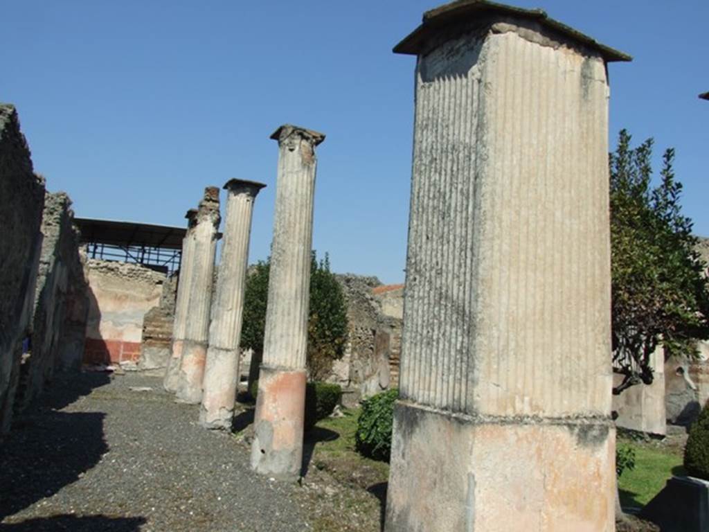 VIII.4.4 Pompeii. March 2009. Area 13, looking north along west portico.
Among the graffiti found, was one on the right wall in the peristyle.
This was either for the purchase or perhaps the sale on a certain day in July of an unspecified year of 200 pounds of hogs lard and 250 bunches of garlic.  
IIX .  ID  IVLIAS  AXVNGIA  P . CC 
ALIV . MANVPLOS  CCL         [CIL IV 2070]
See Pappalardo, U., 2001. La Descrizione di Pompei per Giuseppe Fiorelli (1875). Napoli: Massa Editore. (p.127)
See Jashemski, W. F., 1993. The Gardens of Pompeii, Volume II: Appendices. New York: Caratzas. (p.212)
