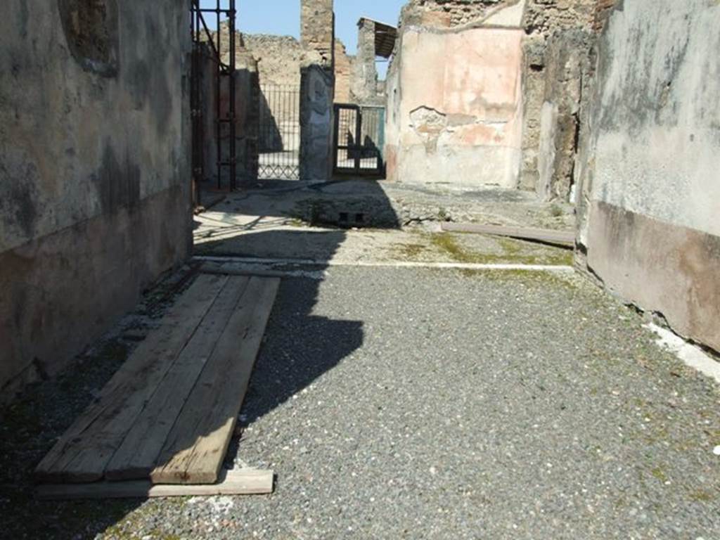 VIII.4.4 Pompeii. March 2009. Room 20, looking north through tablinum to atrium and front entrance. According to Fiorelli, when excavated only one painting remained, showing Venus and Adonis sitting and looking at a nest of three cupids. He said they had also found a fragment of the other painting that had a sitting Endymion.  See Pappalardo, U., 2001. La Descrizione di Pompei per Giuseppe Fiorelli (1875). Napoli: Massa Editore. (p.126) According to the Giornale di Scavi 1861, see page 42: In the tablinum ..  is shown Leda showing Tindarus the twins and Helen just come out of the egg.
