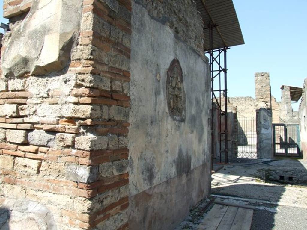 VIII.4.4 Pompeii. March 2009. Room 20, west wall of tablinum. Looking north.
According to Breton, on the west wall facing Leda, the painting was more or less destroyed when excavated.
One could only see a fragment of a sitting person, perhaps Adonis with a dog at his feet.
See Breton, Ernest. 1870. Pompeia, Guide de visite a Pompei, 3rd ed. Paris, Guerin. 
See Helbig, W., 1868. Wandgemlde der vom Vesuv verschtteten Stdte Campaniens. Leipzig: Breitkopf und Hrtel. (961 Endymion?)

According to PPM, at the south end of the west wall in the yellow side panel was another vignette of the Seasons showing Summer (H 984).
Described by Minervini (BAI 1861, p.49) as a naked female figure seen from the rear with cloth draped around her body and legs: in her right hand she held a branch/ear of corn, and a scythe in her left hand.
