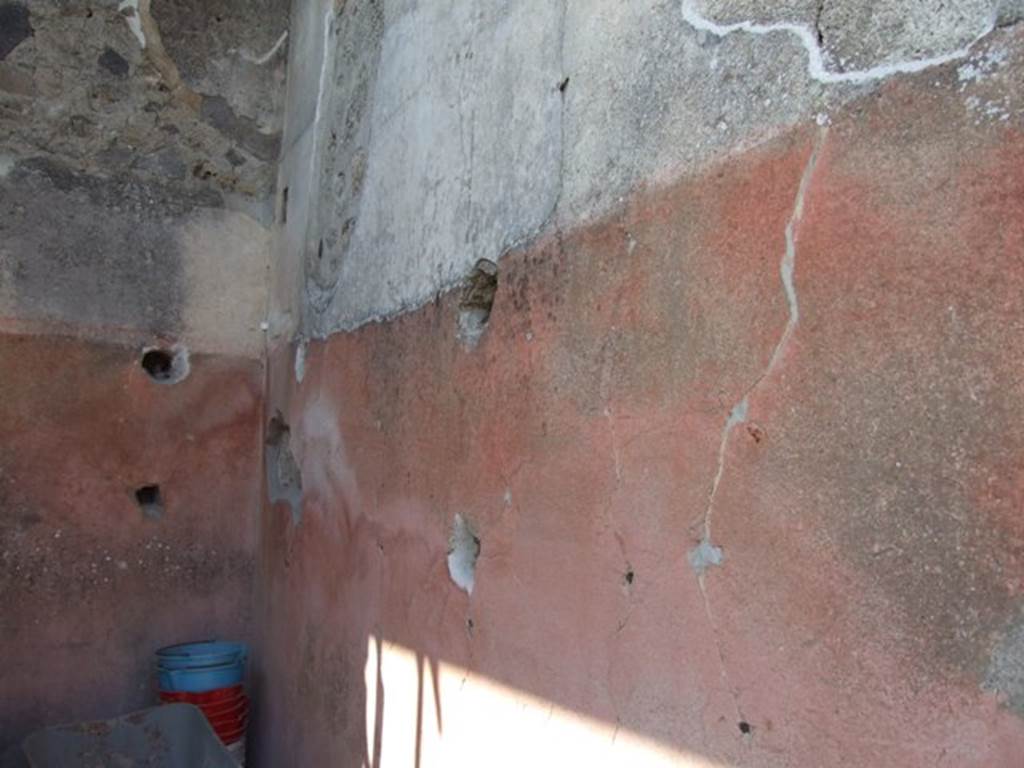 VIII.4.4 Pompeii. March 2009. Room 21, north-west corner of ala or cupboard.   Shelving support holes in west and north walls.
