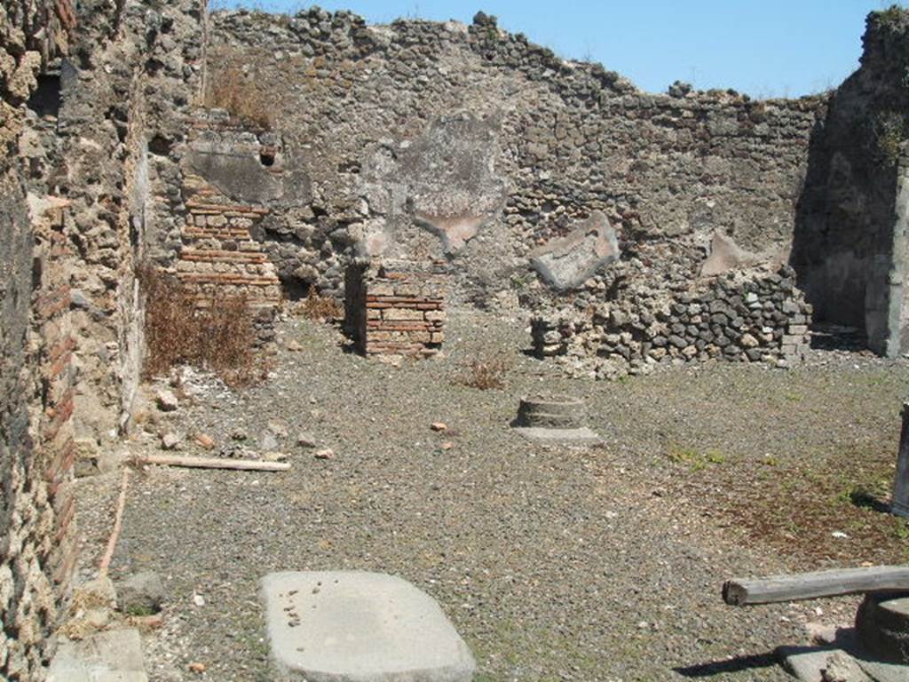 VIII.4.9 from VIII.4.8 Pompeii. May 2005. Looking east across the atrium towards rooms on east side.