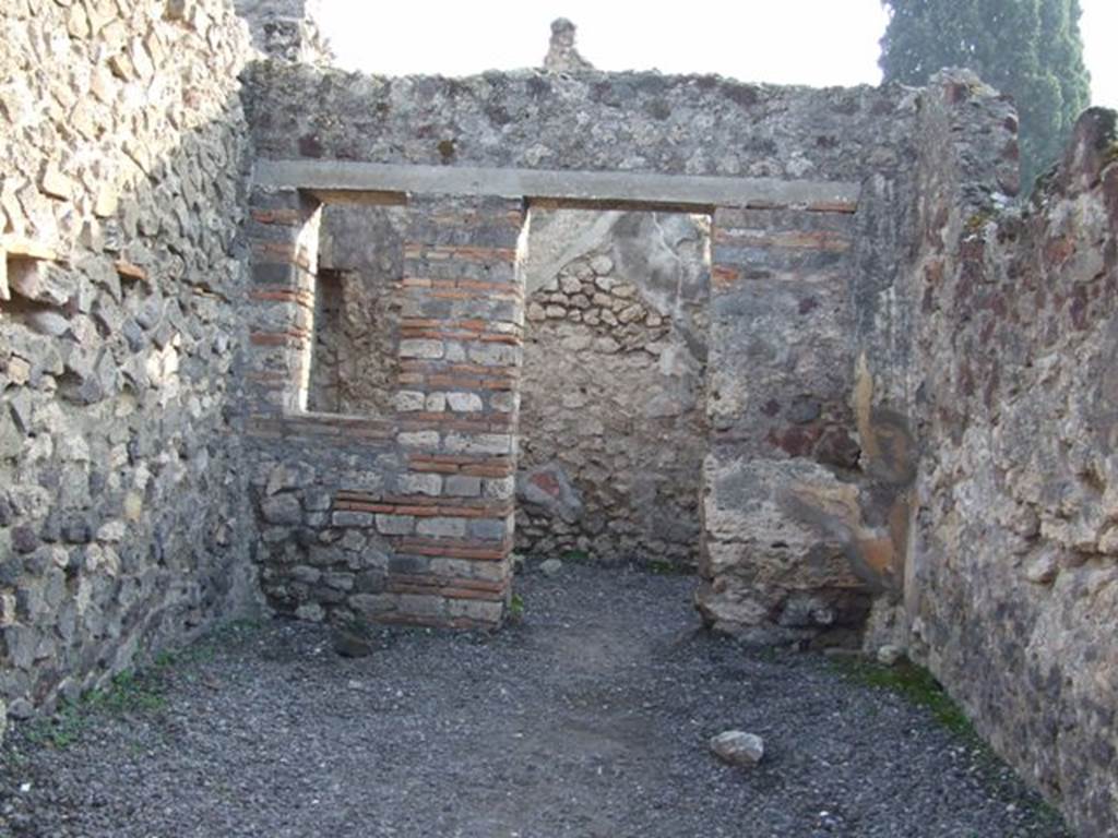 VIII.4.10 Pompeii. December 2007. Looking south to rear room. Boyce said, a window in the south wall was walled up, to form a niche according to Fiorelli.
See Boyce G. K., 1937. Corpus of the Lararia of Pompeii. Rome: MAAR 14.  (p.76)
See Pappalardo, U., 2001. La Descrizione di Pompei per Giuseppe Fiorelli (1875). Napoli: Massa Editore. (p.128)
