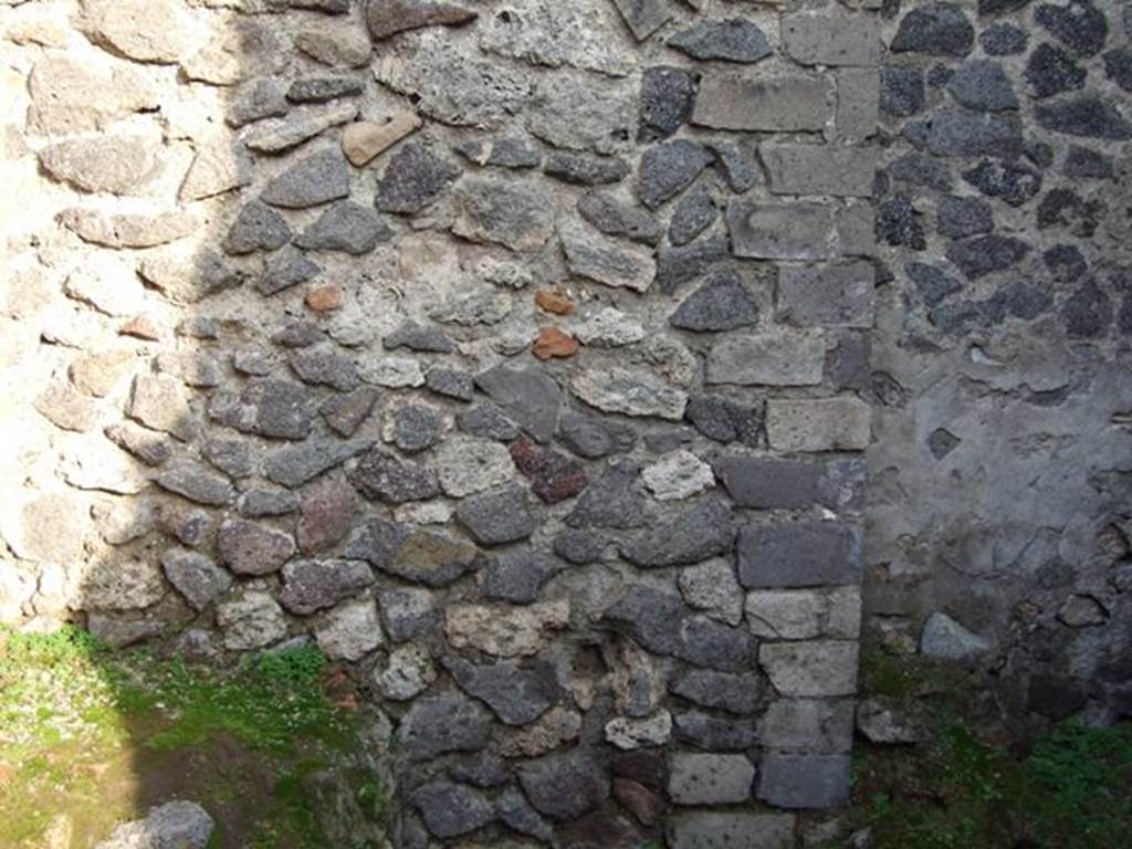 VIII.4.10 Pompeii.  Shop and room.  December 2007.  East wall of rear room.