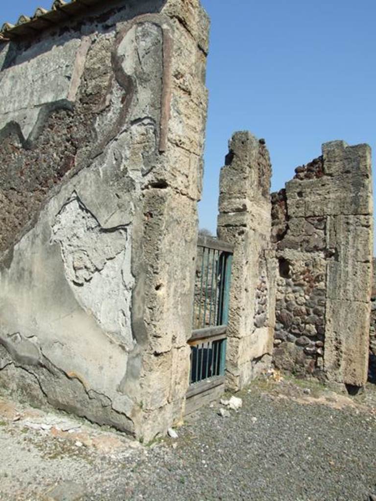 VIII.4.15 Pompeii.  March 2009.  Doorway to shop at VIII.4.16, in north east corner of atrium.