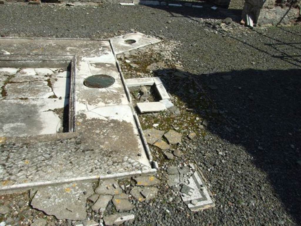 VIII.4.15 Pompeii. March 2009. Room 1, impluvium in atrium. Looking east across the south side. According to Jashemski, this house was one of many which, after the introduction of the aqueduct, had a fountain in the atrium. 
Between the two table supports that stood at the edge of the impluvium there was a round opening which contained the bronze key. This controlled the jet in the middle of the impluvium.
See Jashemski, W. F., 1993. The Gardens of Pompeii, Volume II: Appendices. New York: Caratzas. (p.213)
