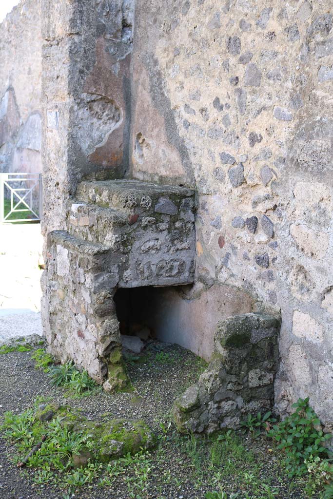 VIII.4.25 Pompeii. December 2018. 
Looking towards south-east corner of shop-room and remains of masonry counter and shelving.
Photo courtesy of Aude Durand.
