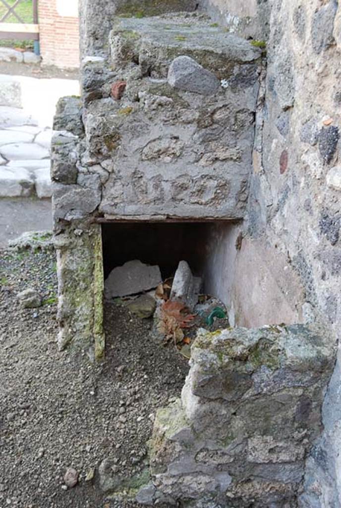 VIII.4.25 Pompeii. November 2008. Looking east towards remains of masonry counter with stepped shelves. Photo courtesy of Nicolas Monteix.
