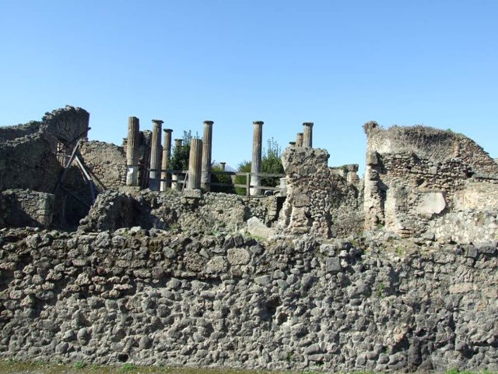 VIII.4.29 Pompeii. March 2009. Looking north from Via del Tempio dIside, across remains of peristyle area, behind wall. According to Boyce, in this peristyle high up on the north wall was an arched niche.
See Boyce G. K., 1937. Corpus of the Lararia of Pompeii. Rome: MAAR 14. (p.76) 
