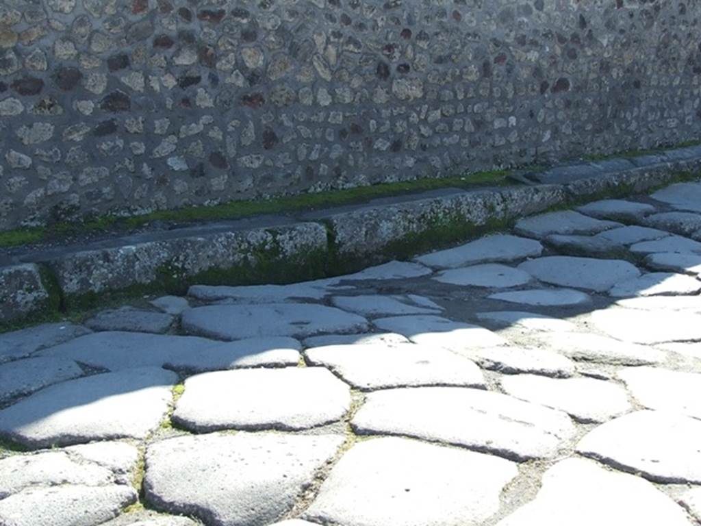 VIII.4.34 Pompeii.  March 2009.  Subsidence in road outside.  Looking south towards wall of VIII.7.29.