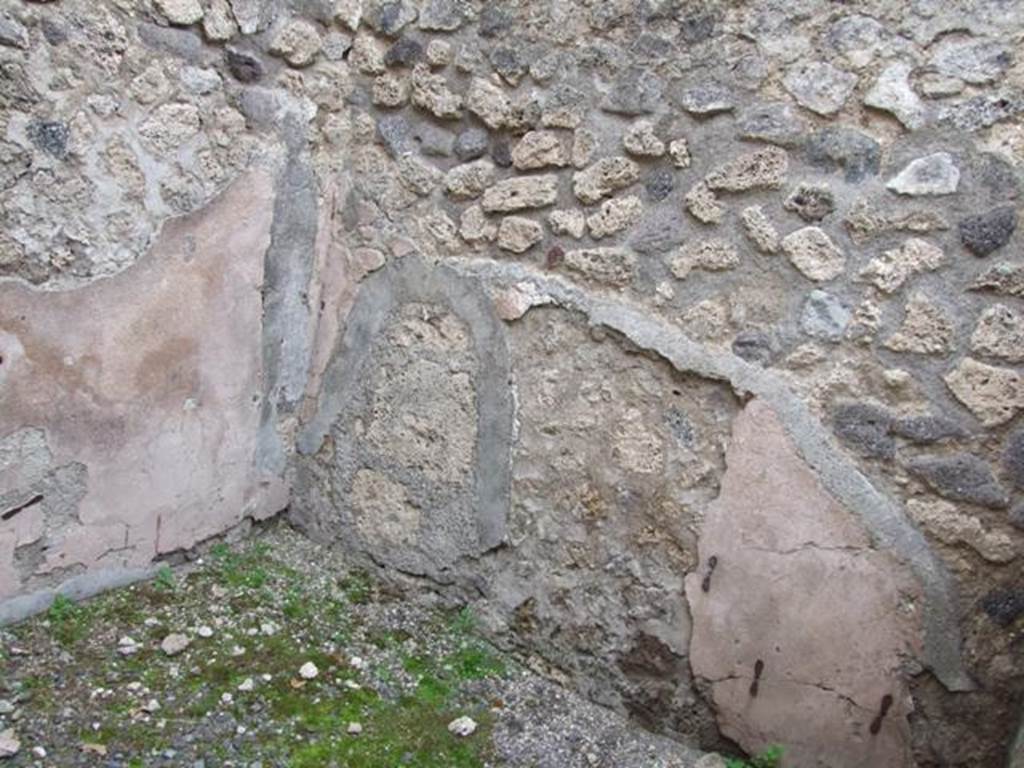 VIII.4.46 Pompeii. December 2007. South-east corner of rear room with remains of painted plaster.