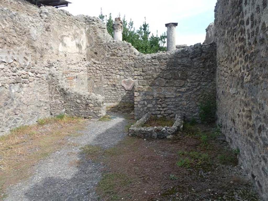 VIII.4.48 Pompeii. September 2015. Looking east across shop-room, towards doorway into rear room.