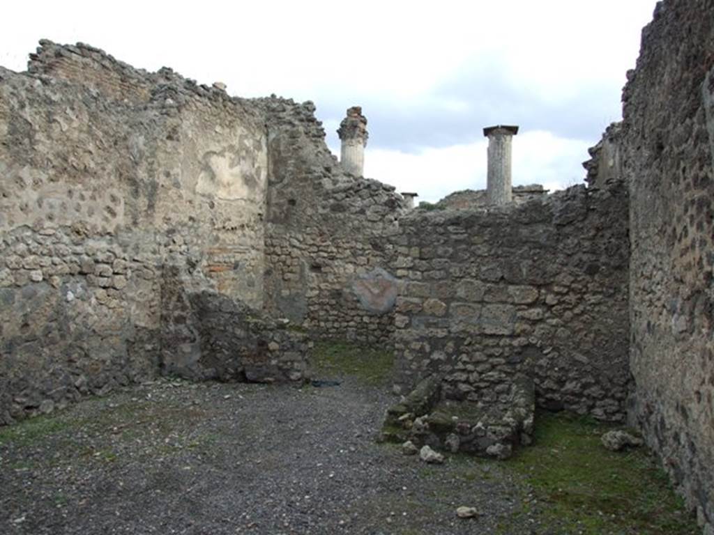 VIII.4.48 Pompeii. December 2007. East wall of shop with remains of vat or tub, and latrine on its south side, (on the right).