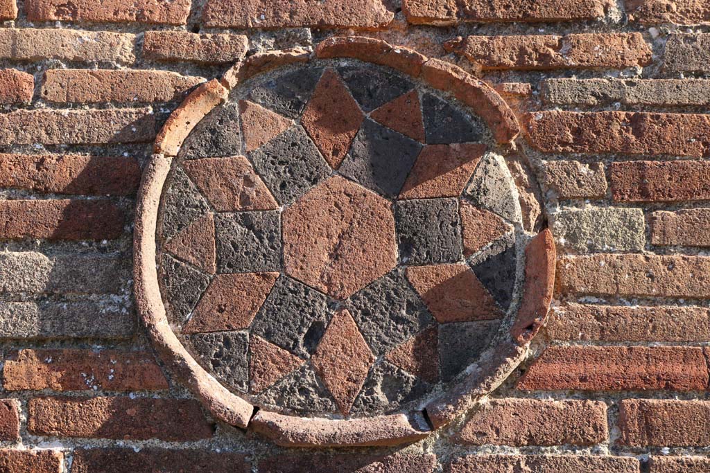 VIII.4.53 Pompeii. December 2018. 
Detail of plaque, on left side of entrance doorway in Via dei Teatri. Photo courtesy of Aude Durand.

