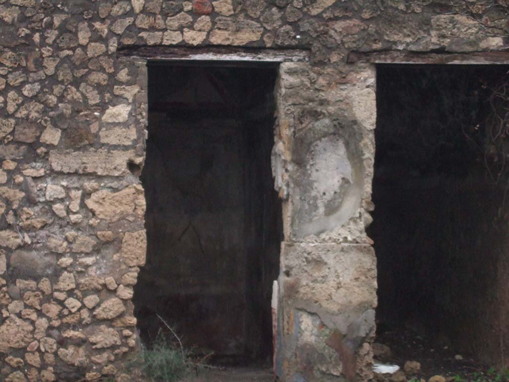 VIII.5.5 Pompeii. December 2005. Doorways to rooms in south-west corner of atrium.