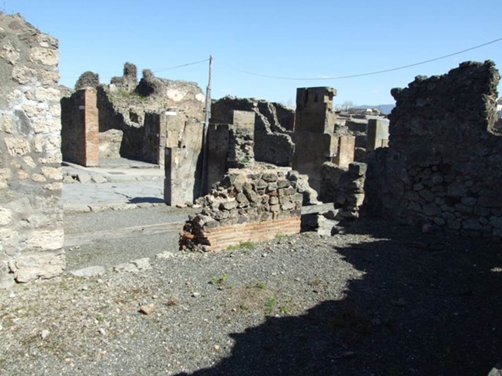 VIII.5.9 Pompeii.  March 2009.  Room 11. Looking north down step to Shop at VIII.5. 11 and linked to VIII.5.12