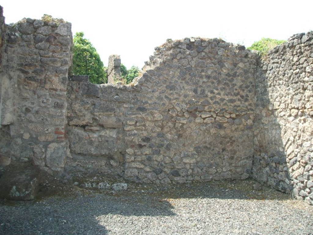 VIII.5.10 Pompeii.  Shop.  May 2005.  South wall, with blocked door to atrium of VIII.5.9.