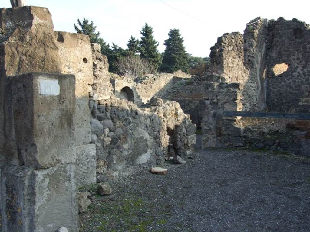 VIII.5.11 Pompeii.  Shop.  December 2007.  East wall with entrance to VIII.5.12.