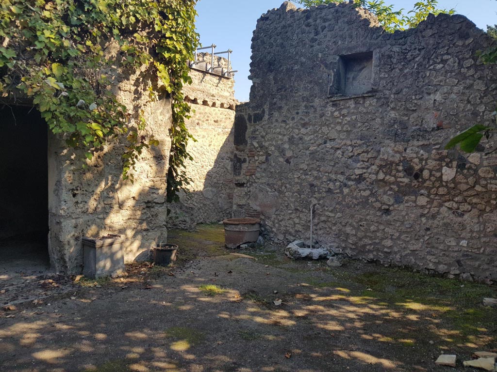 VIII.5.15 Pompeii. October 2022. 
Room 2, looking towards north-east corner, with very high recess in east wall. Photo courtesy of Klaus Heese.
