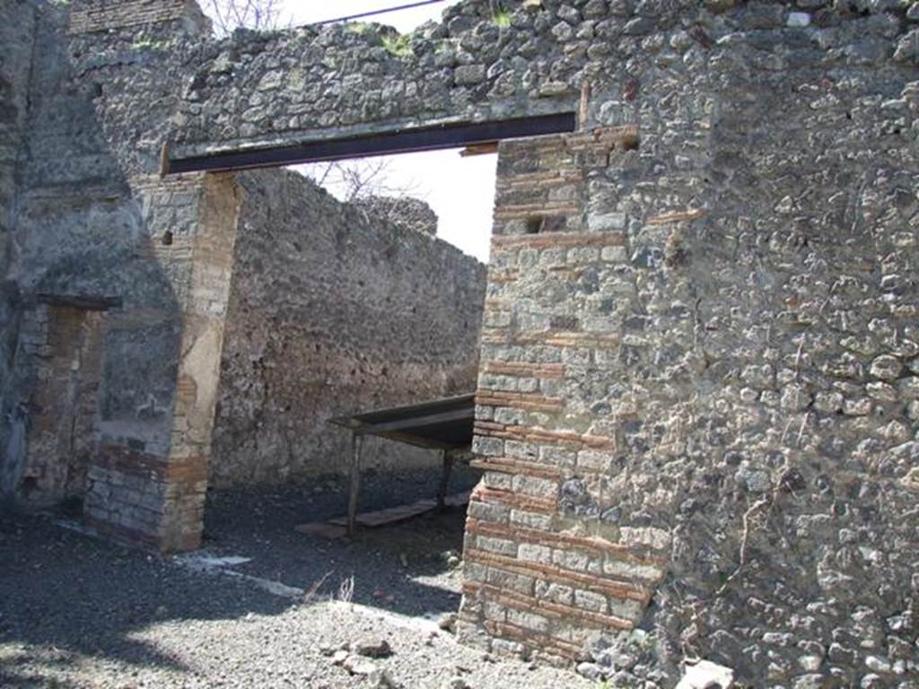 VIII.5.28 Pompeii. March 2009. Doorways to room 11, large triclinium.
According to PPM  in this room -
Pernice described the only mosaic floor of the house, in black tesserae with a white tesserae border and threshold with an ivy branch made in black on a white background. (III Style).
See Carratelli, G. P., 1990-2003. Pompei: Pitture e Mosaici.8 (VIII). Roma: Istituto della enciclopedia italiana, (p. 611).
