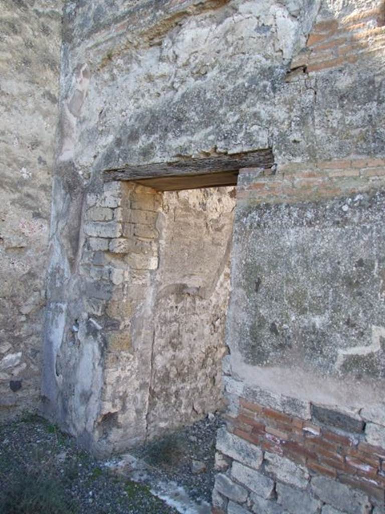 VIII.5.28 Pompeii.  March 2009.  Small Second doorway to Room 11, Triclinium, on south side of West Portico.