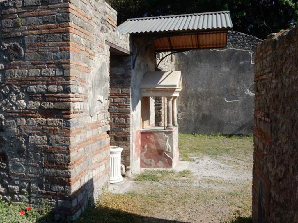 VIII.5.37 Pompeii. May 2017. Room 6, looking south from corridor towards lararium on east side of atrium.  Photo courtesy of Buzz Ferebee.

