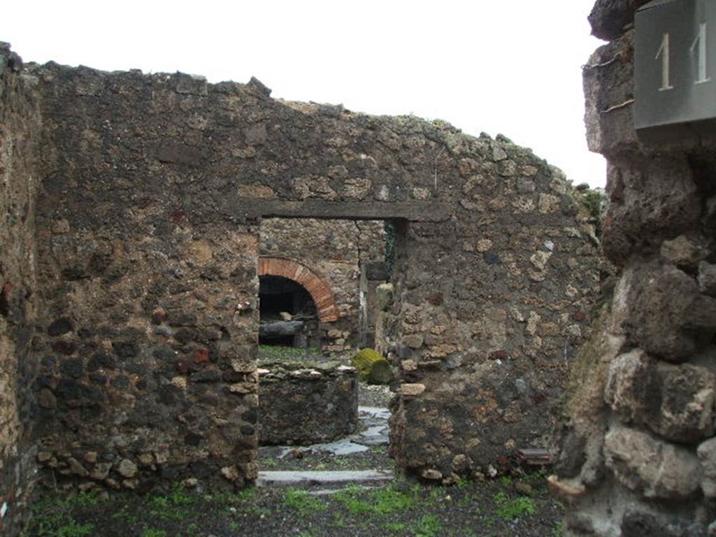 VIII.6.11 Pompeii. December 2004. Looking east from entrance across room “f” or stable, towards bakery.