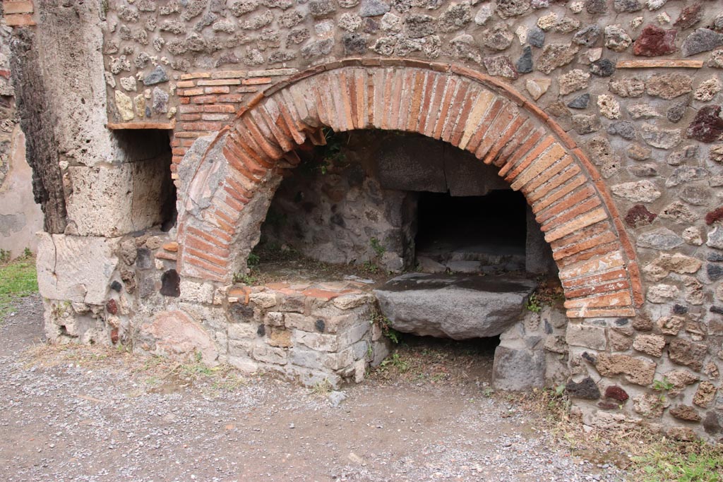 VIII.6.11 Pompeii. May 2024. Looking towards east side of bakery room, with oven. Photo courtesy of Klaus Heese.