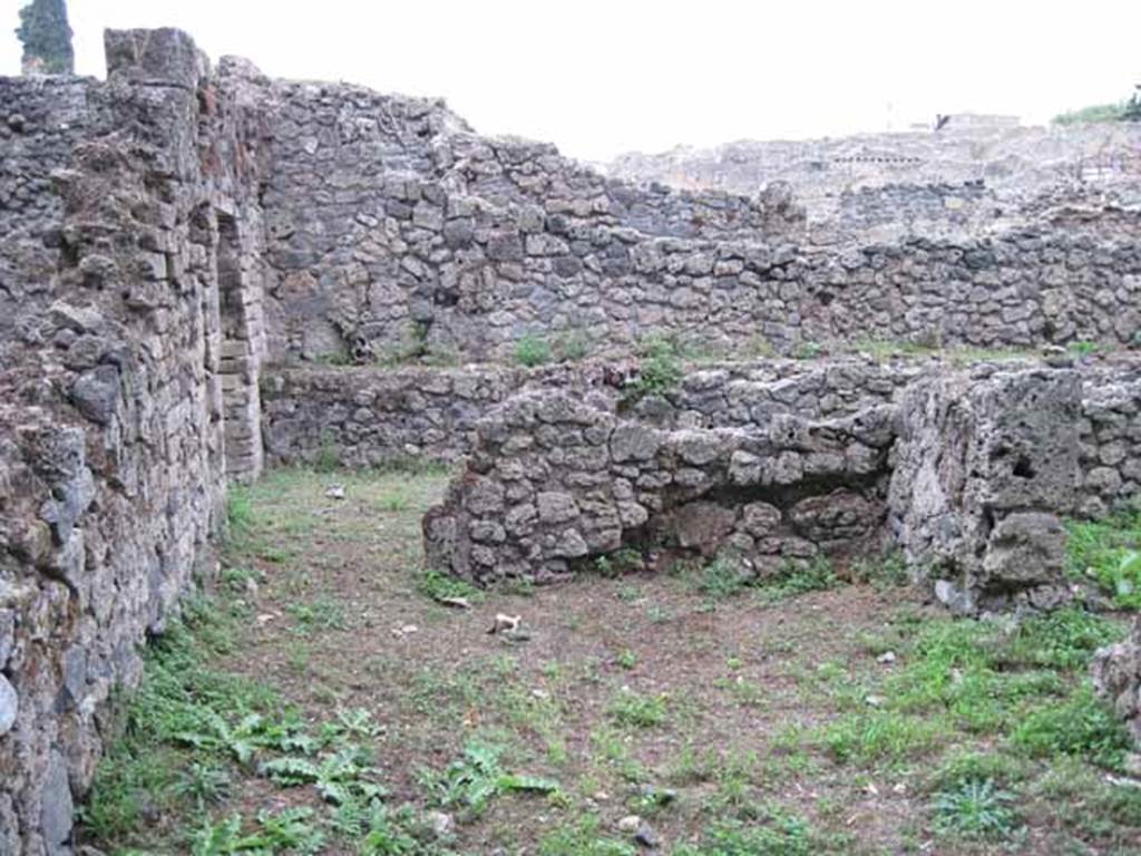 VIII.7.1 Pompeii. September 2010.  Photo courtesy of Drew Baker.
 Rear of entrance room looking north towards doorway to room, possibly a dormitory.  According to Fiorelli, the site of a stable manger was against the wall. The wall was a painted wall giving him the impression that originally the hospitium had seen better days. The doorway to the area used as the stable can be seen on the right.  See Pappalardo, U., 2001. La Descrizione di Pompei per Giuseppe Fiorelli (1875). Napoli: Massa Editore. (p.131)


