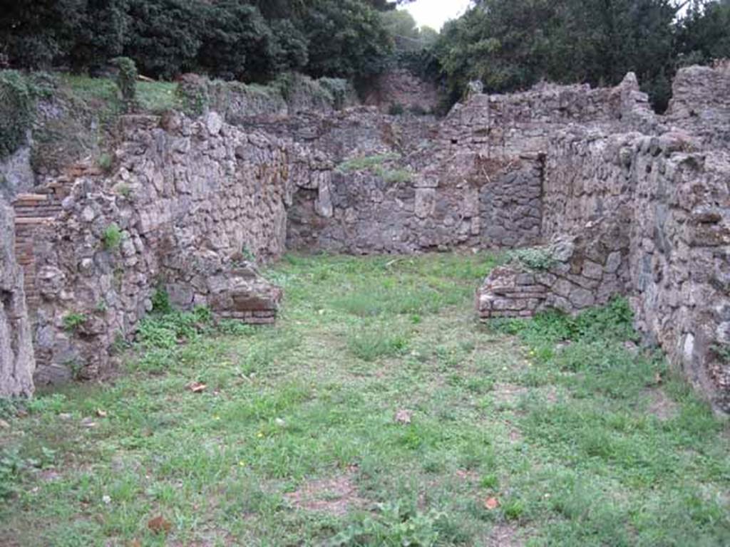 VIII.7.3 Pompeii. September 2010. Looking west across shop towards rear room, from entrance.  Photo courtesy of Drew Baker.
